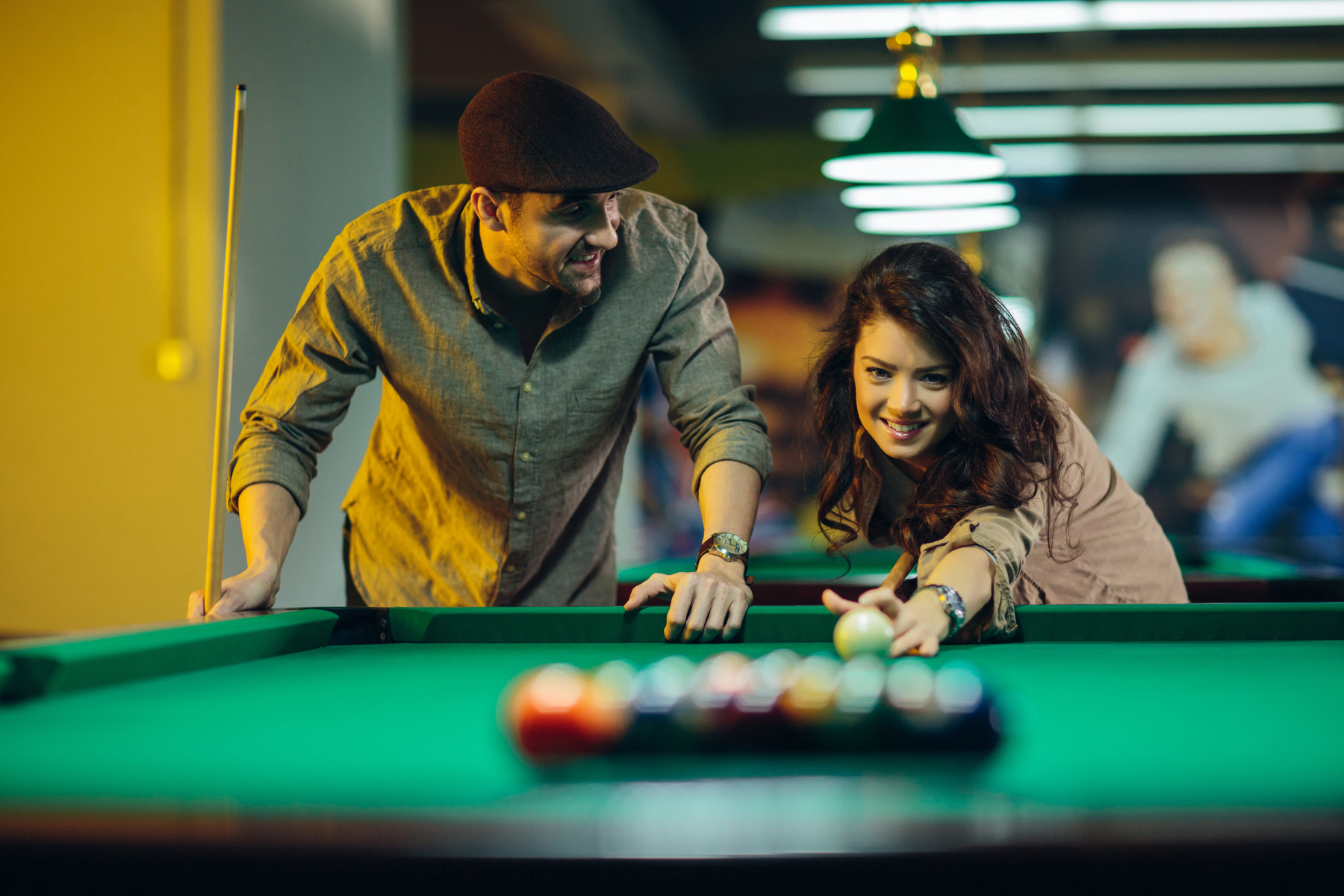 couple playing pool